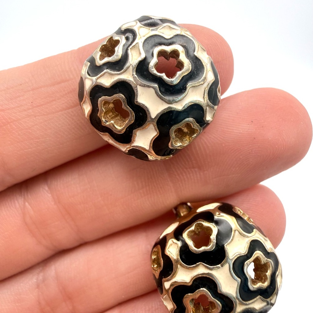 St.John floral cut out, clip earrings, black cream enamel, gold tone